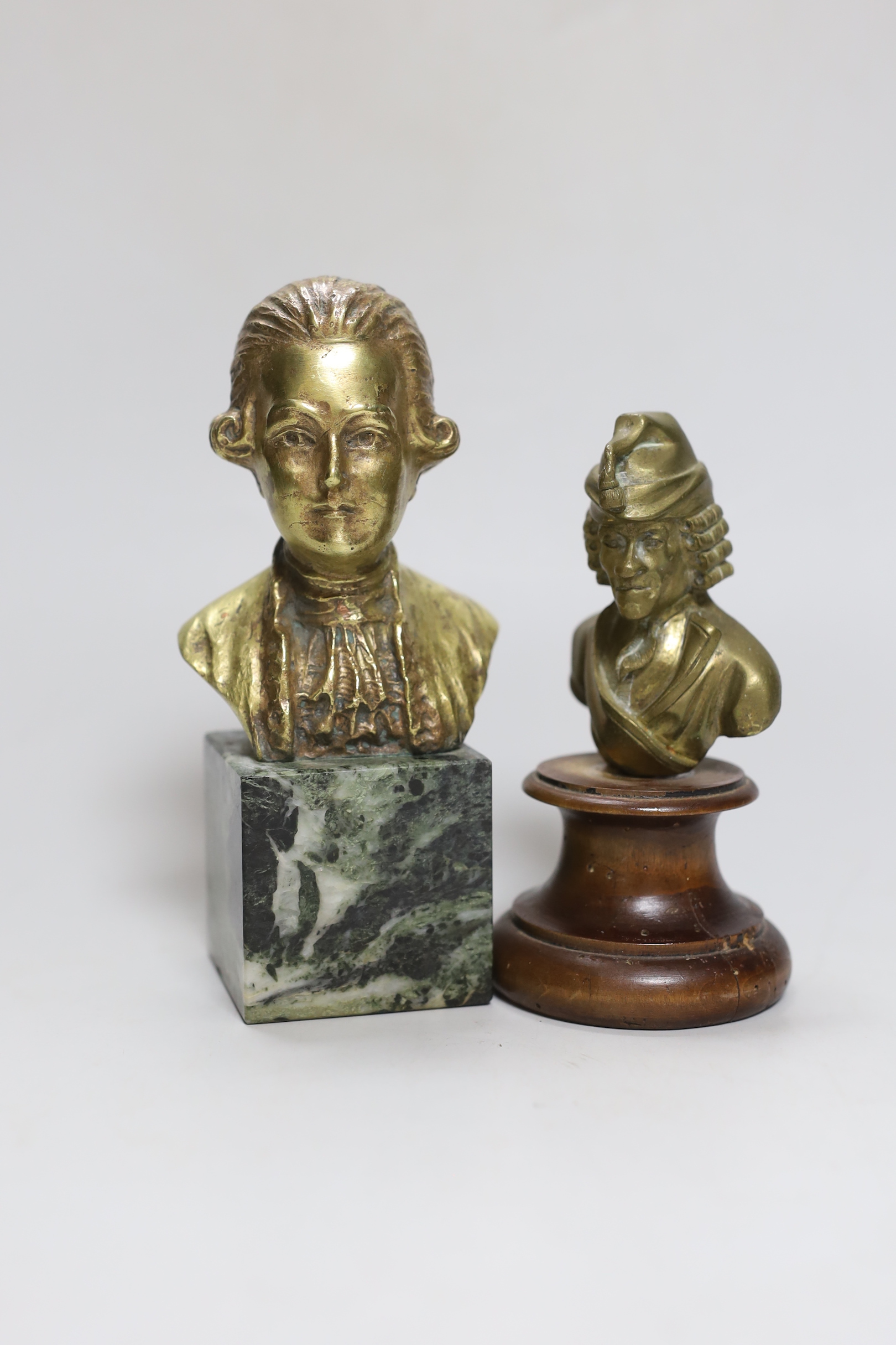 Onesta: A bronze bust of a musician, and a similar bust on wooden stand, Onesta bust 16.5cm high